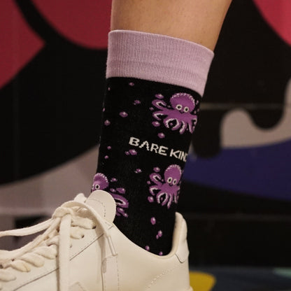 model wearing purple octopus bamboo socks