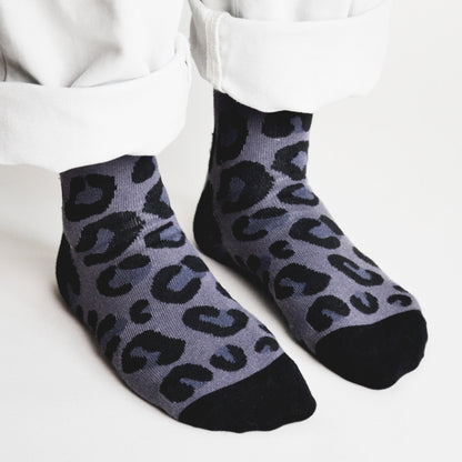 model wearing grey black panther print bamboo socks