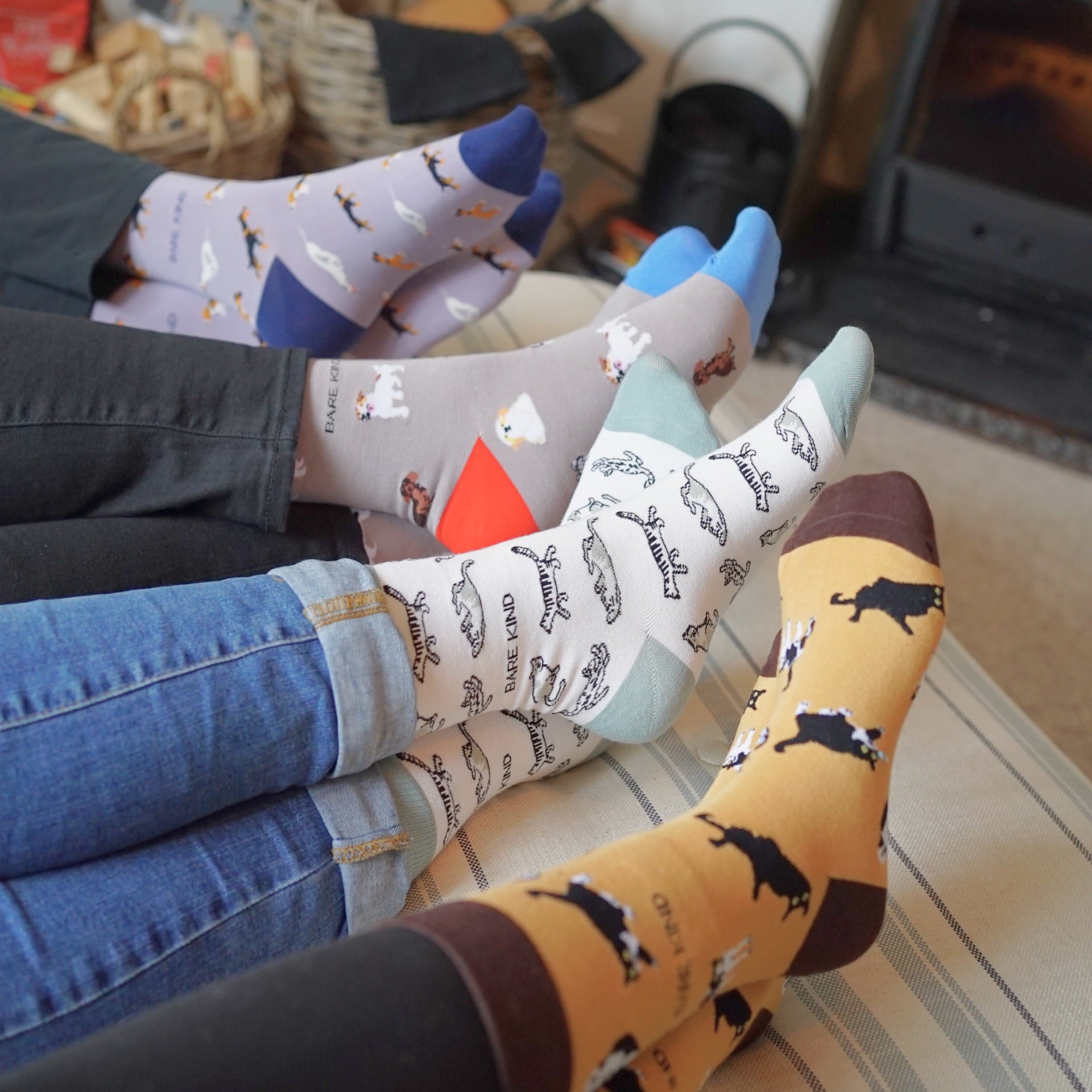 people wearing grey dog, purple dog, brown cat, green cat bamboo socks