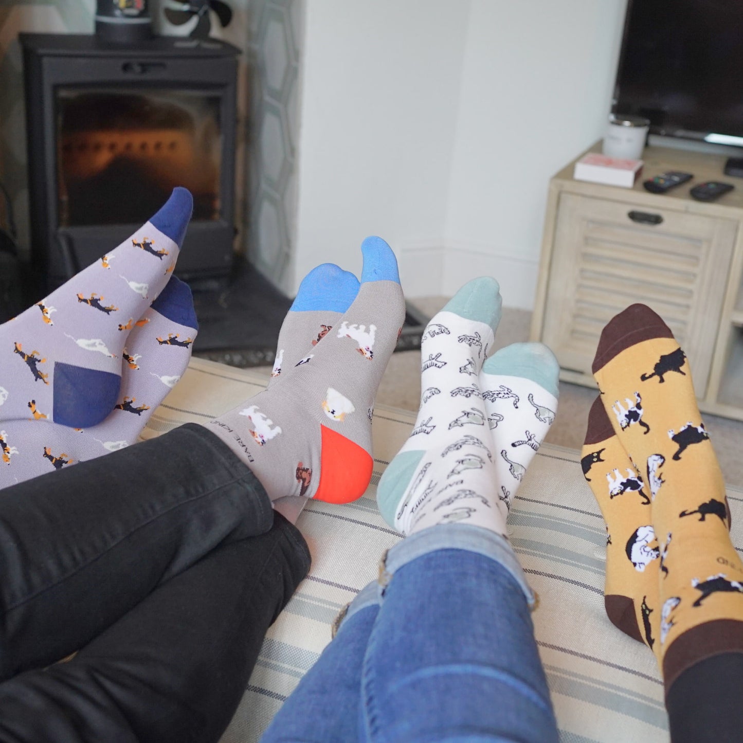 people wearing grey dog, purple dog, brown cat, green cat bamboo socks