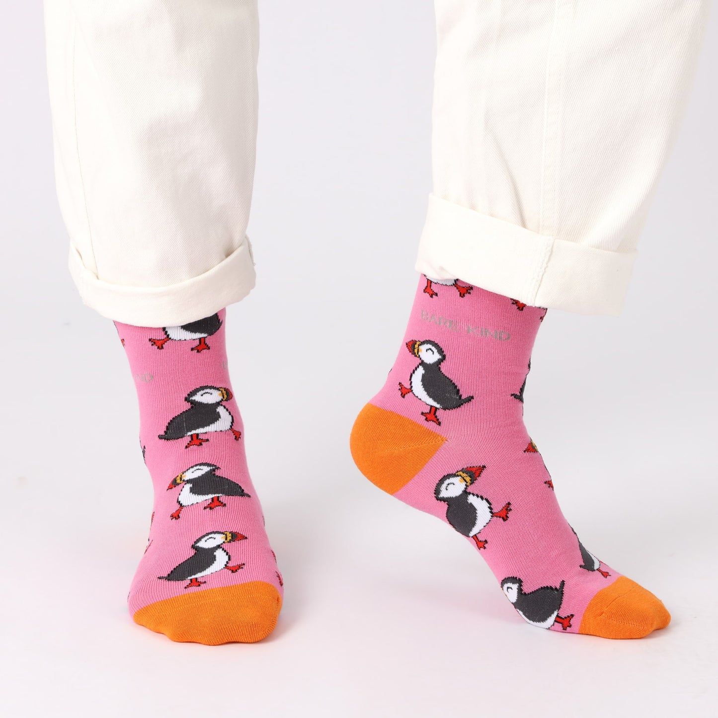 model wearing pink puffin bamboo socks