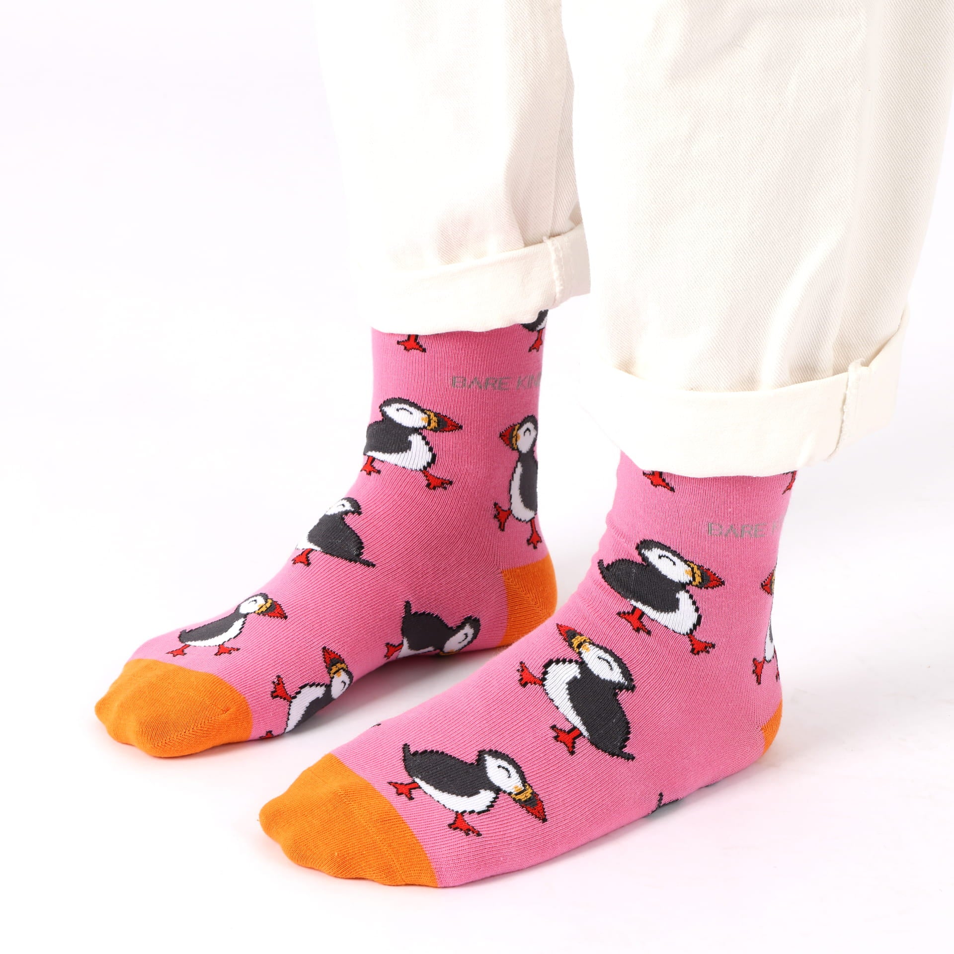 model wearing pink puffin bamboo socks