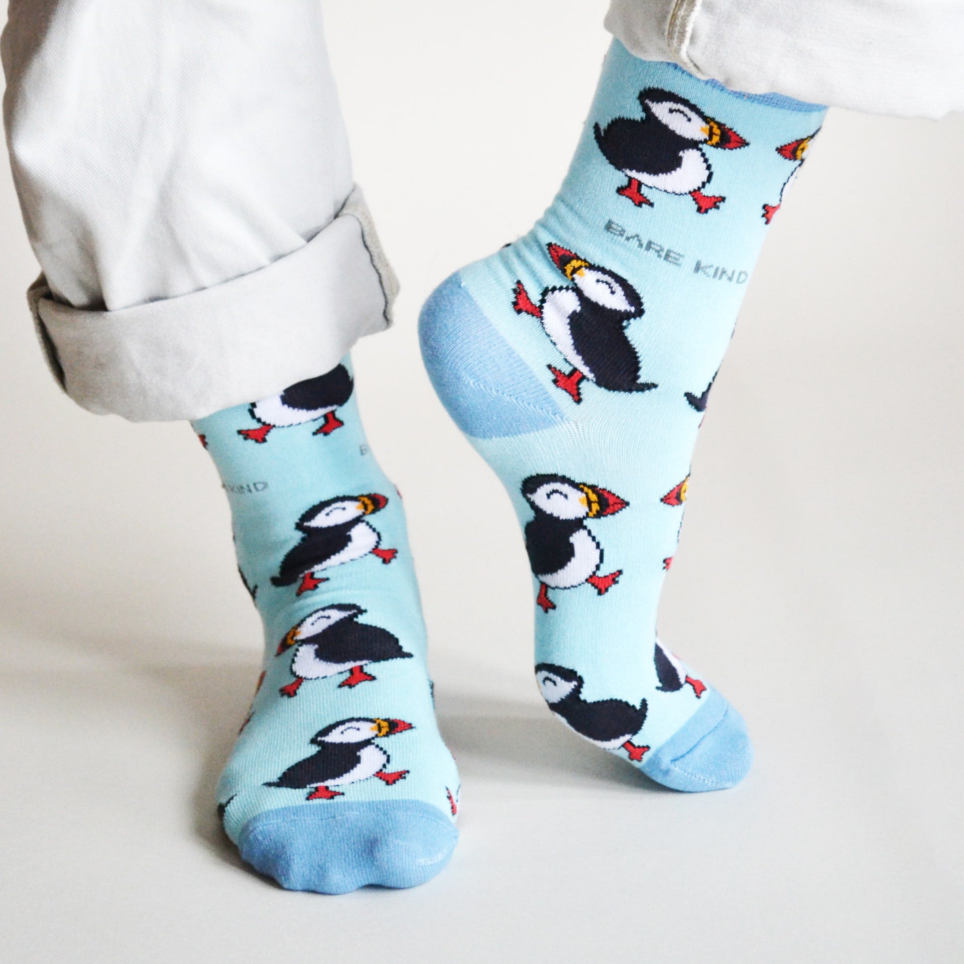 model wearing blue puffin bamboo socks