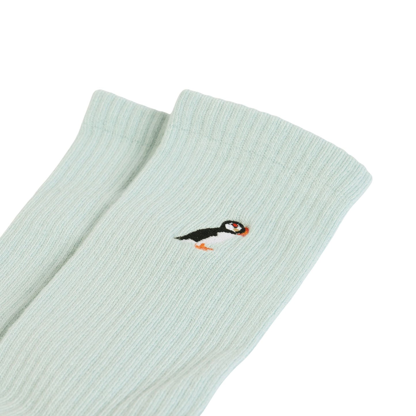 flat lays of blue puffin ribbed bamboo socks
