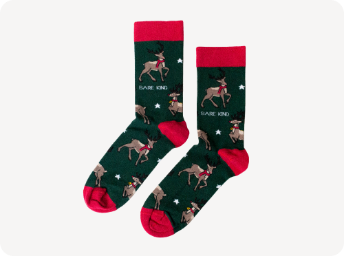 flat lay of green red reindeer bamboo socks