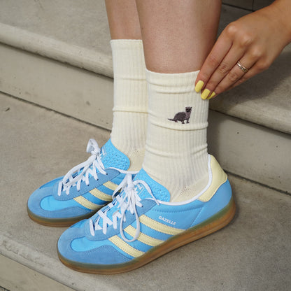 model wearing yellow ribbed otter bamboo socks