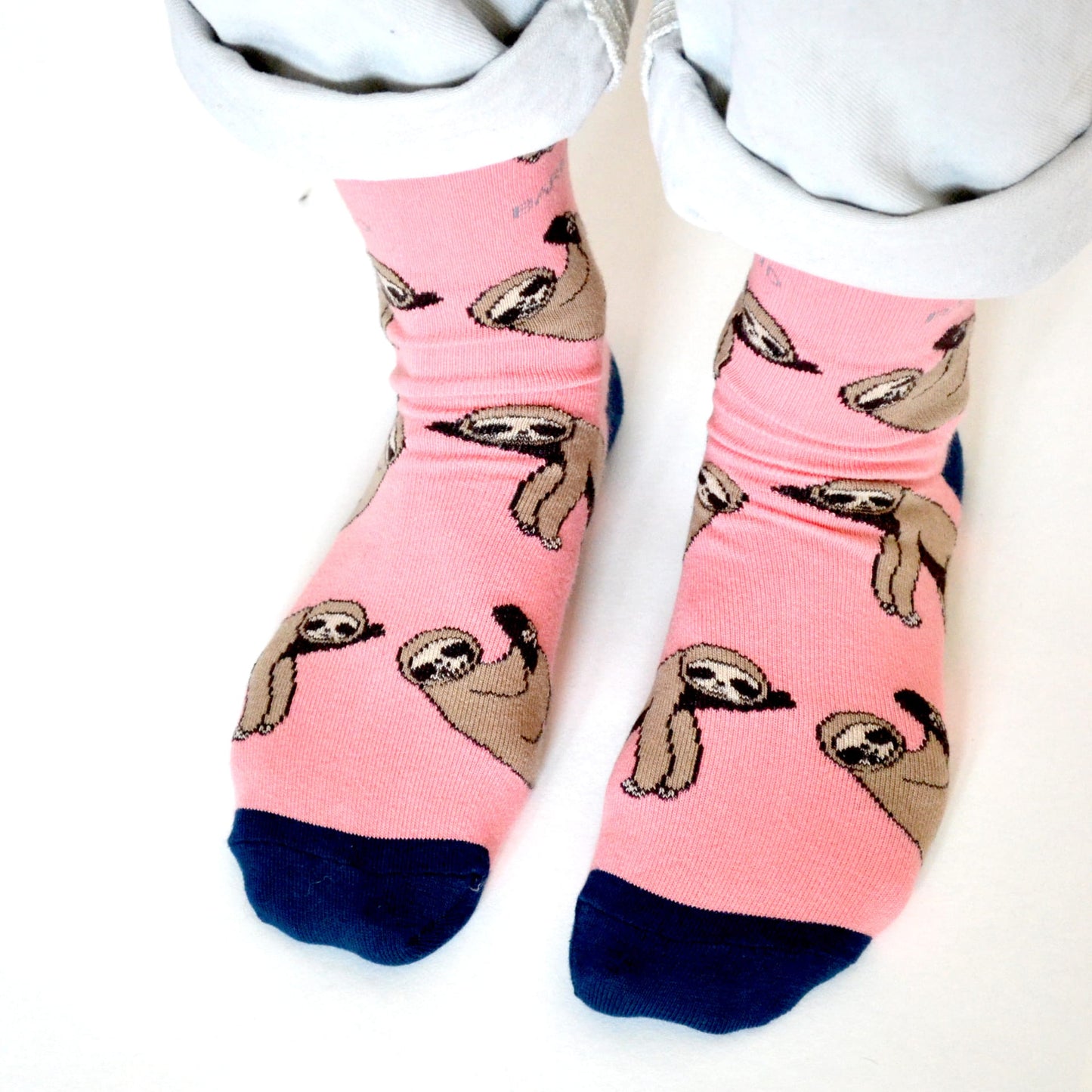 model wearing pink sloth bamboo socks