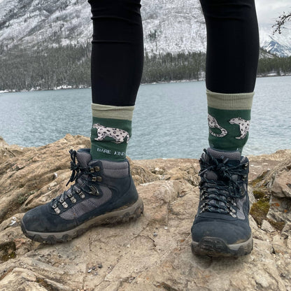 model wearing green snow leopard bamboo socks