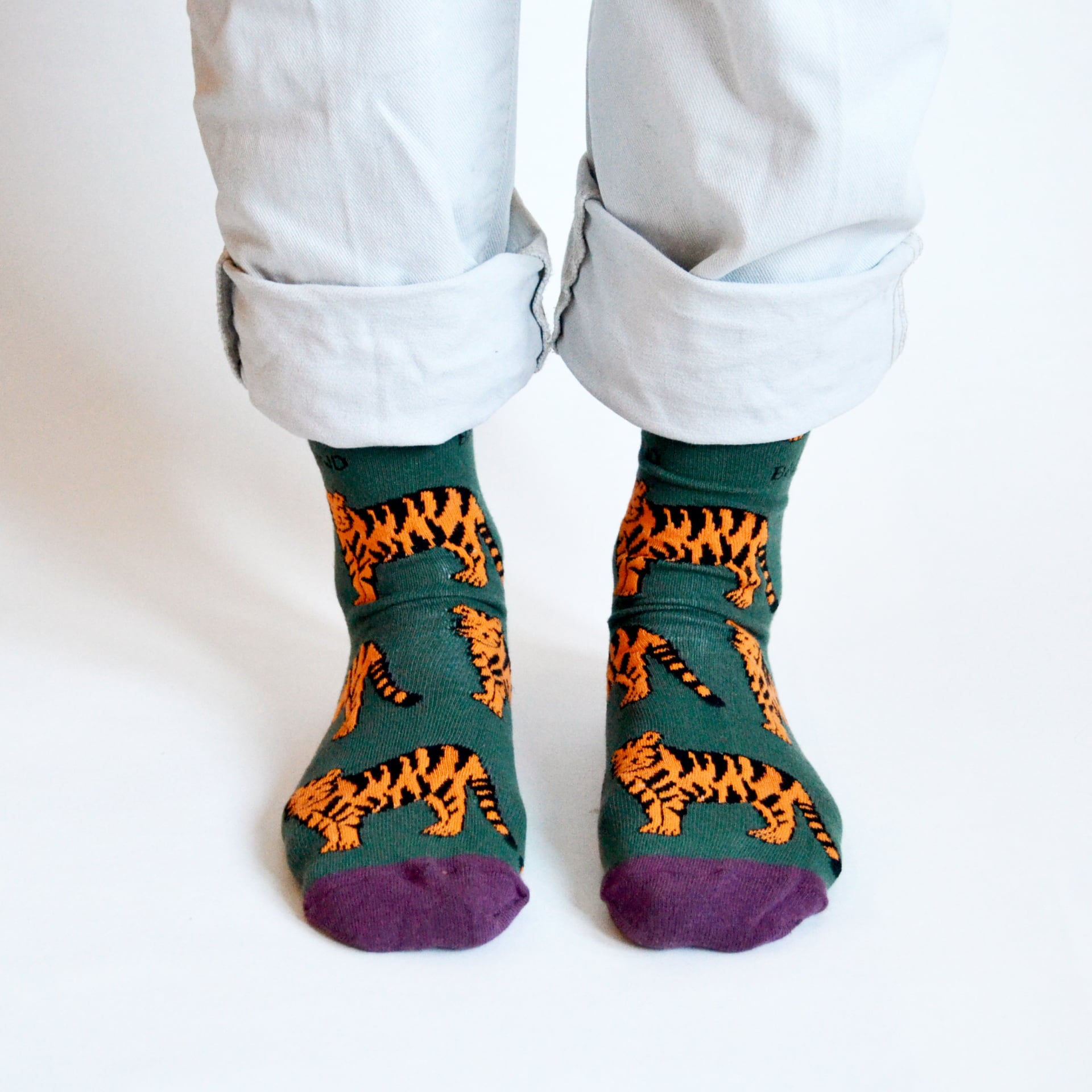 model wearing green tiger bamboo socks