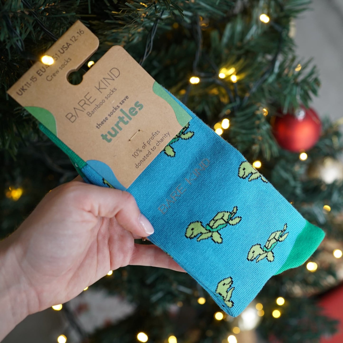 turtle bamboo socks packaging in front of christmas tree