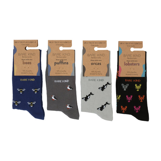 Flat lay of Bare Kind bamboo socks packaging, featuring small motifs of bees, puffins, orcas, and lobsters.