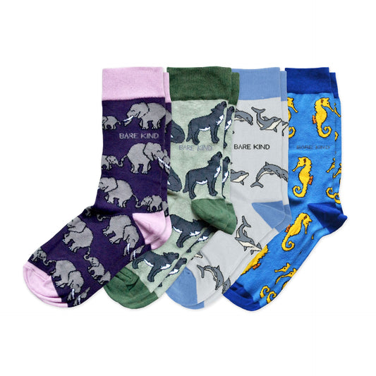 flat lays of purple elephant, green wolf, blue dolphin, blue seahorse bamboo socks