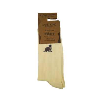 Packaging picture of yellow ribbed bamboo socks with otter embroidered design on cuff