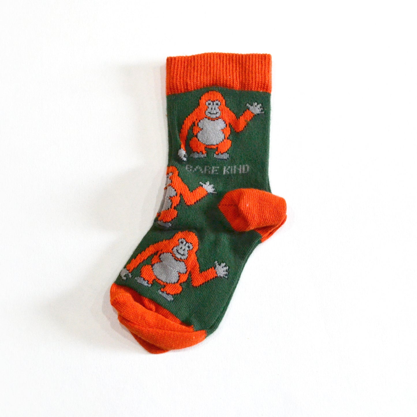 single flat lay of dark green bamboo orangutan socks for kids