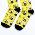 toe closeup flat lay of black and yellow bee bamboo socks