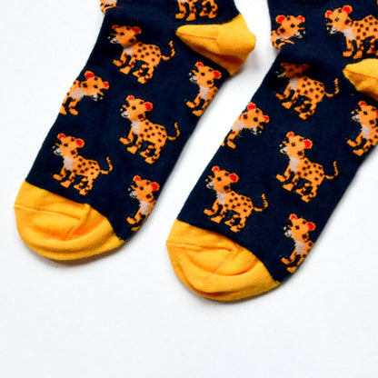 toe closeup flat lay of navy blue bamboo socks featuring leopard designs