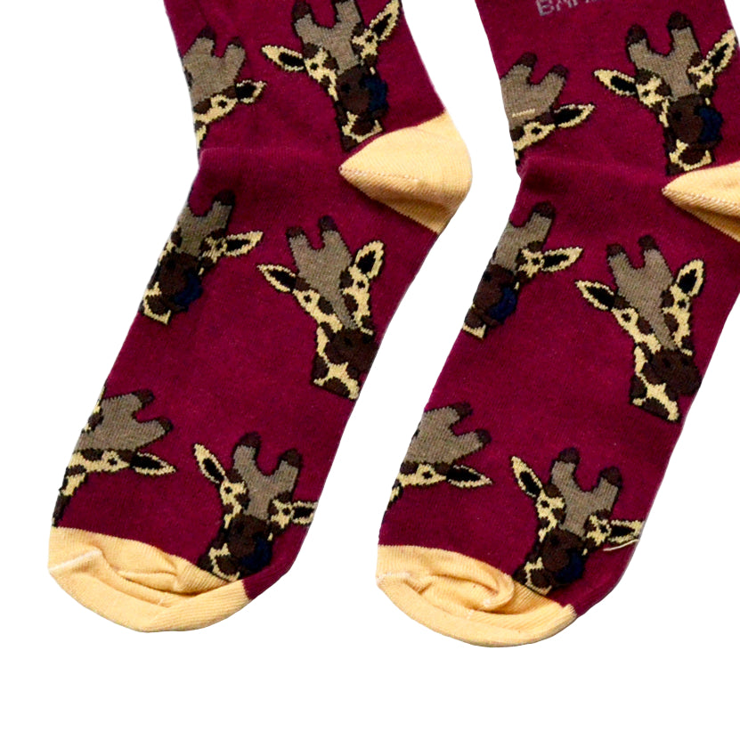 toe closeup flat lay of burgundy bamboo socks in giraffe print