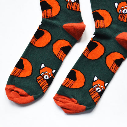 toe closeup flat lay of dark green bamboo socks with woven red panda design