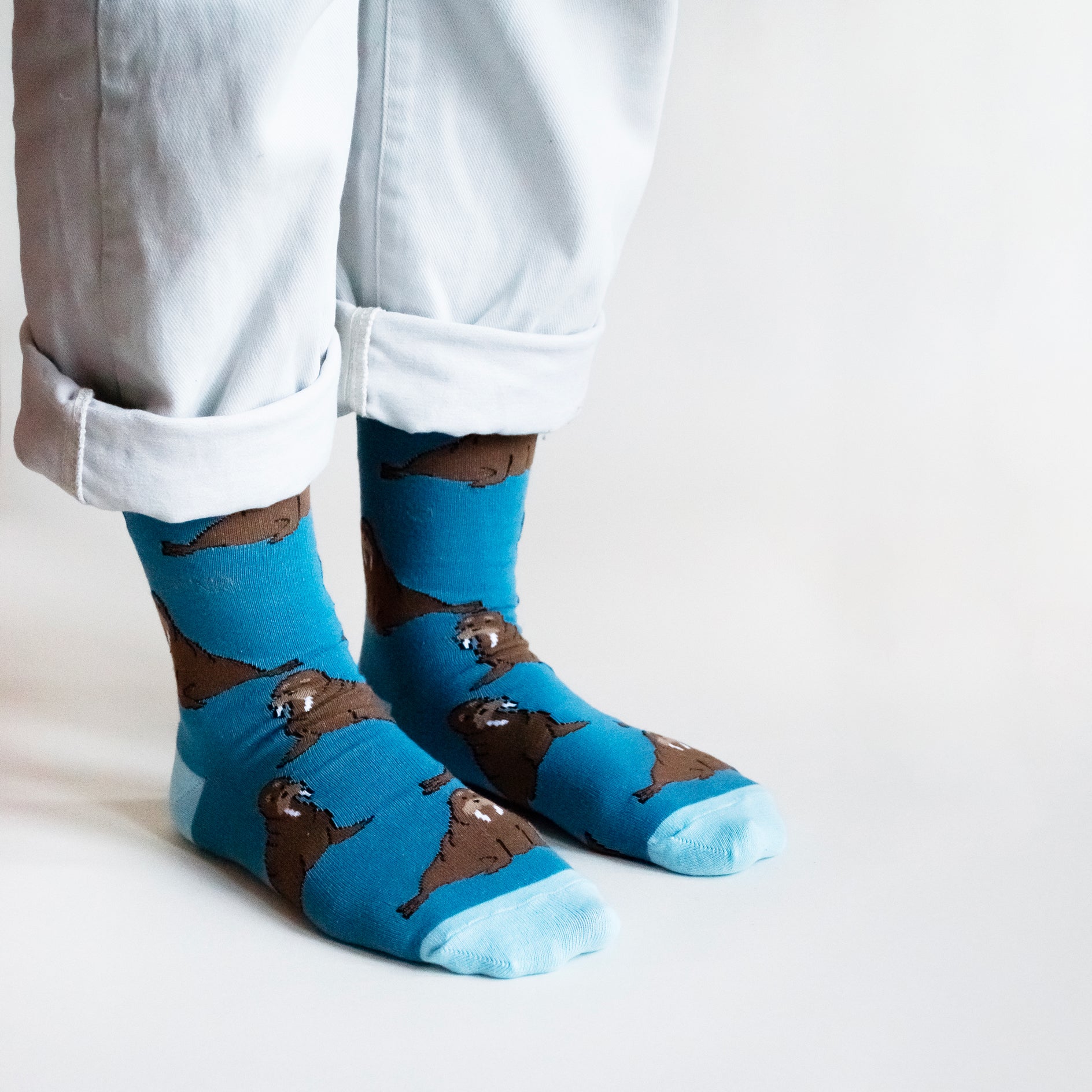 standing model wearing bamboo walrus socks, side angle view