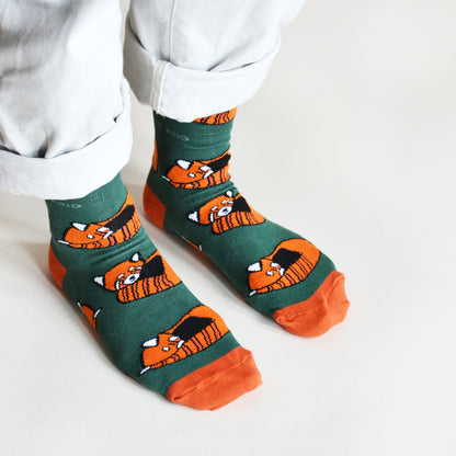 standing model wearing red panda bamboo socks