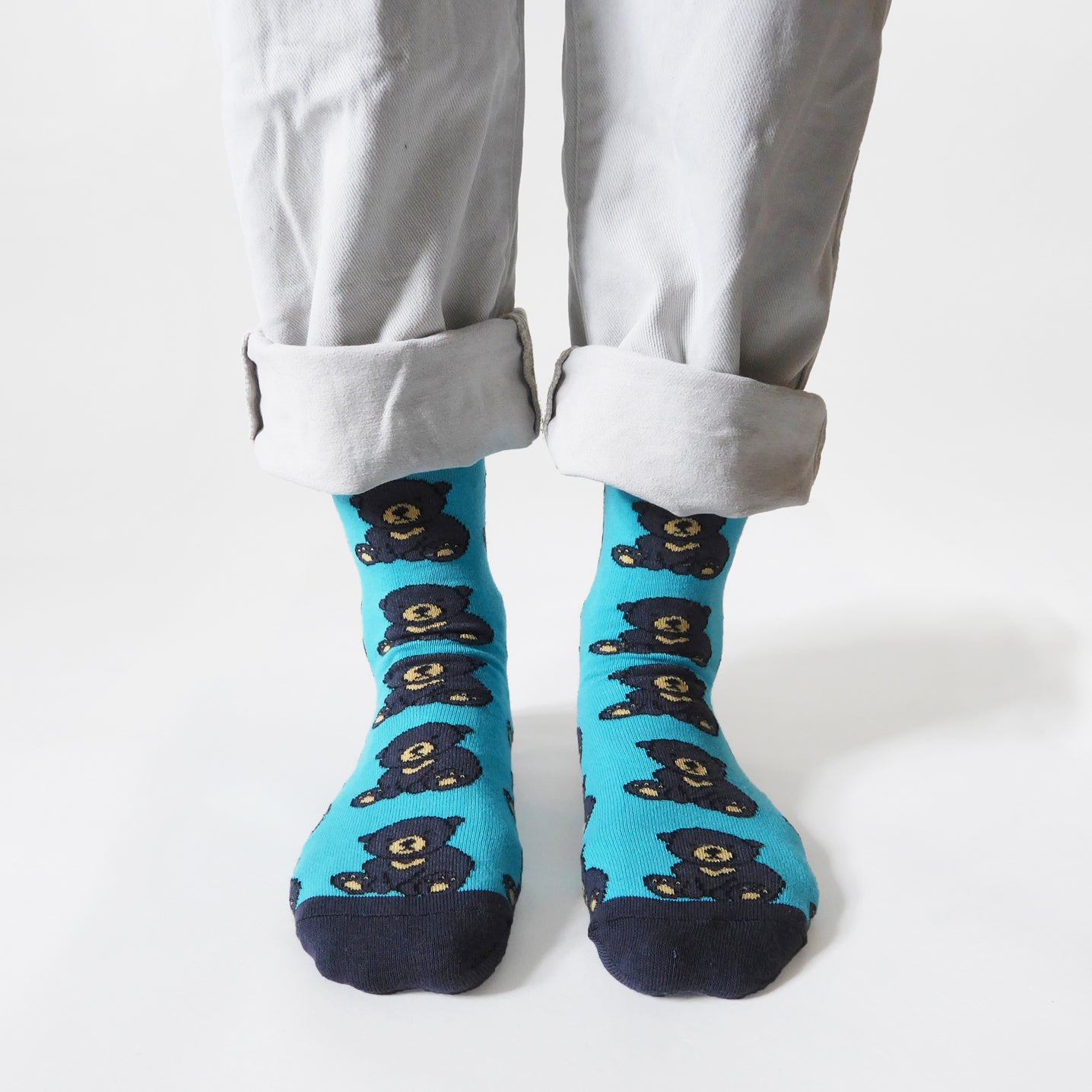 standing model, front view, wearing blue sun bear bamboo socks