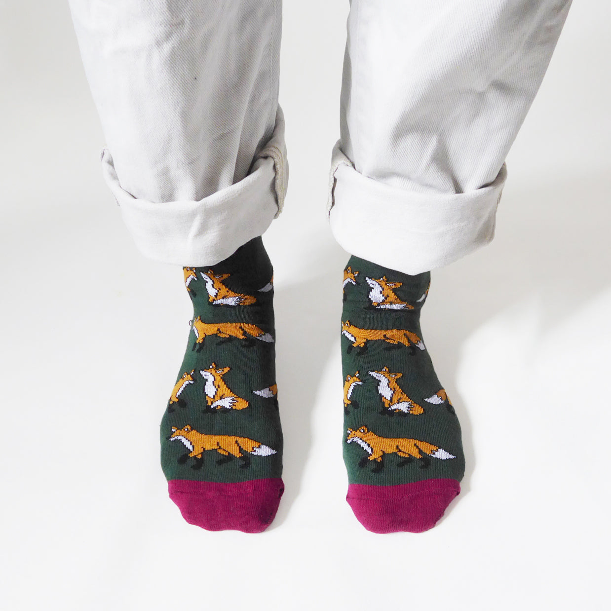 birds eye view of standing model wearing dark green fox socks