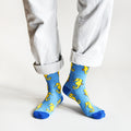 standing model wearing blue seahorse socks